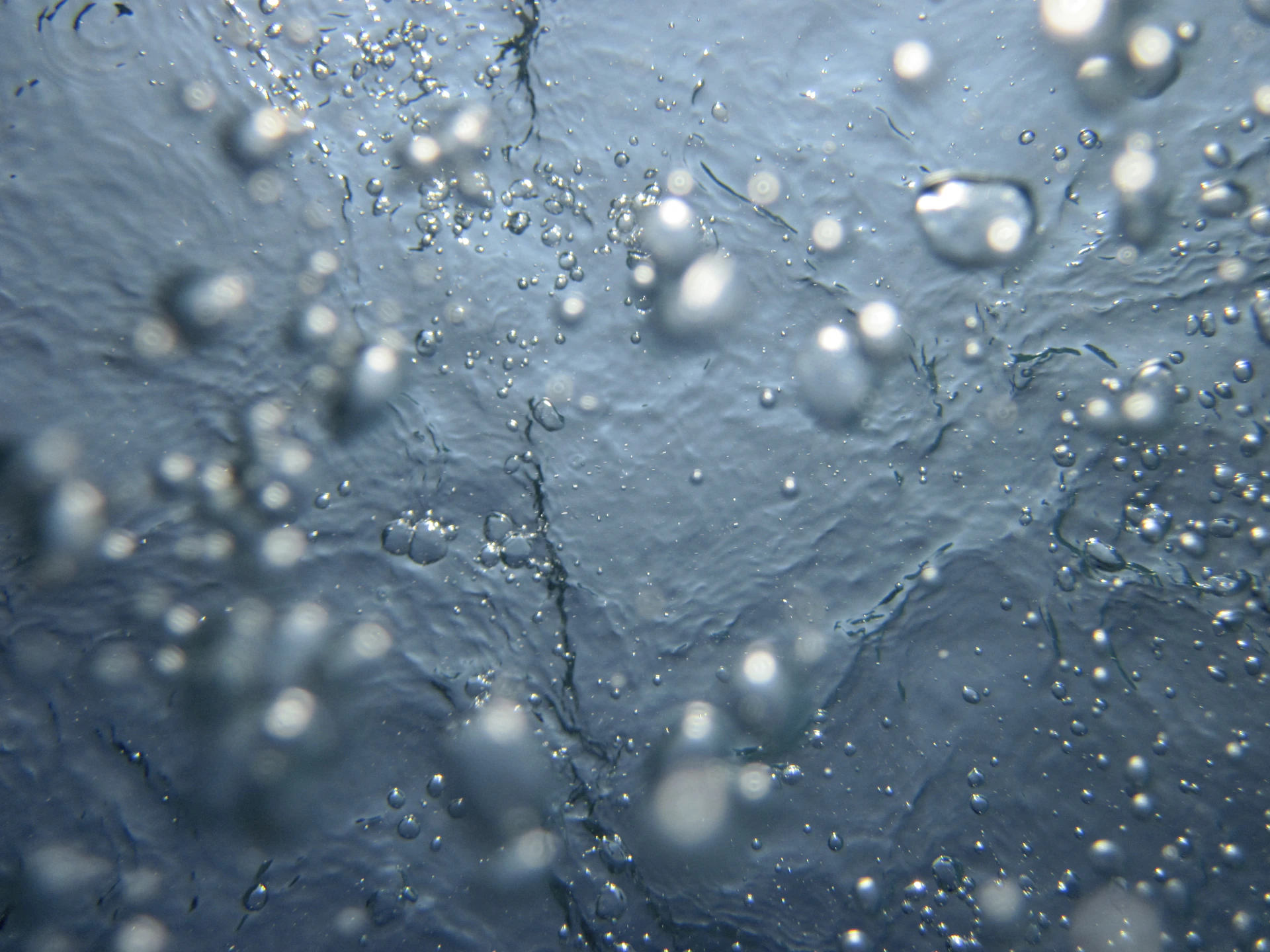 A close up of water bubbles on a surface