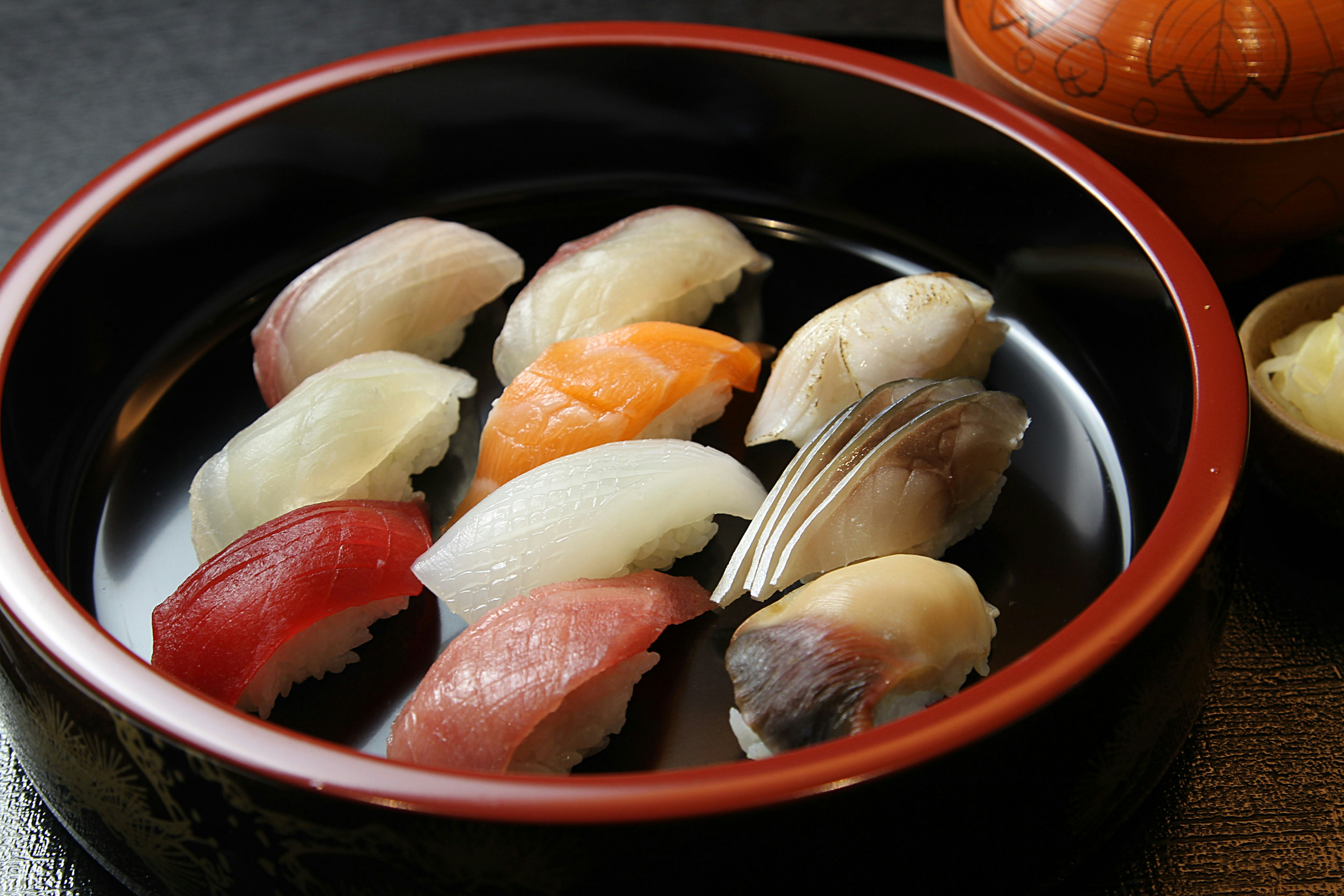 A bowl filled with different types of sushi