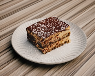 A piece of cake sitting on top of a white plate