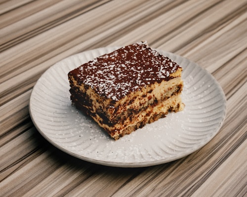 A piece of cake sitting on top of a white plate