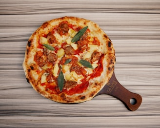 A pizza sitting on top of a wooden cutting board