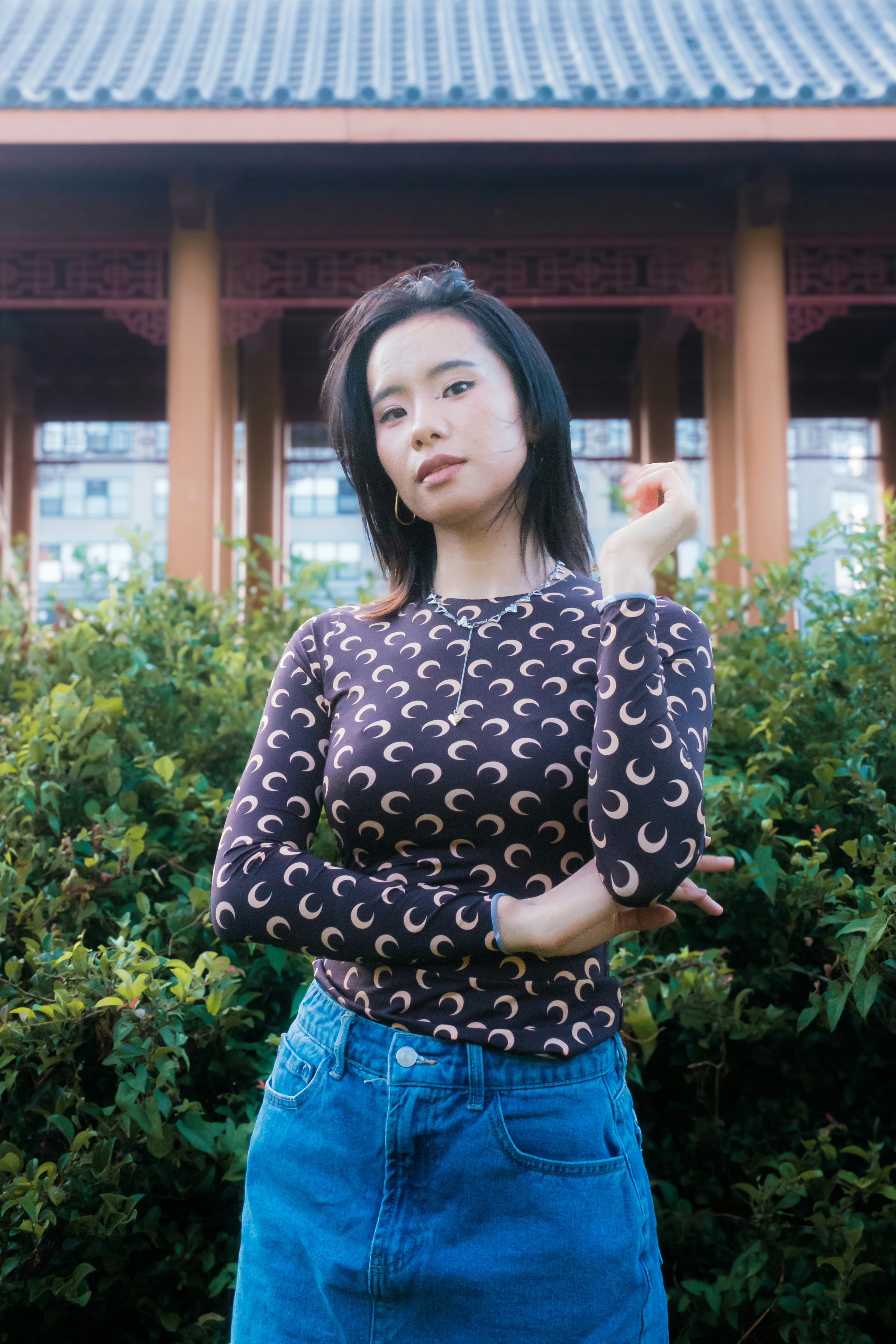 A woman standing in front of a building