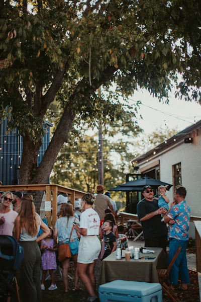 A group of people standing around a table