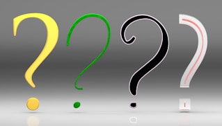 A group of question marks sitting next to each other