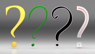 A group of question marks sitting next to each other