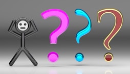 A person standing in front of a group of question marks