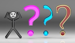 A person standing in front of a group of question marks