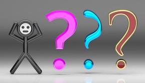 A person standing in front of a group of question marks
