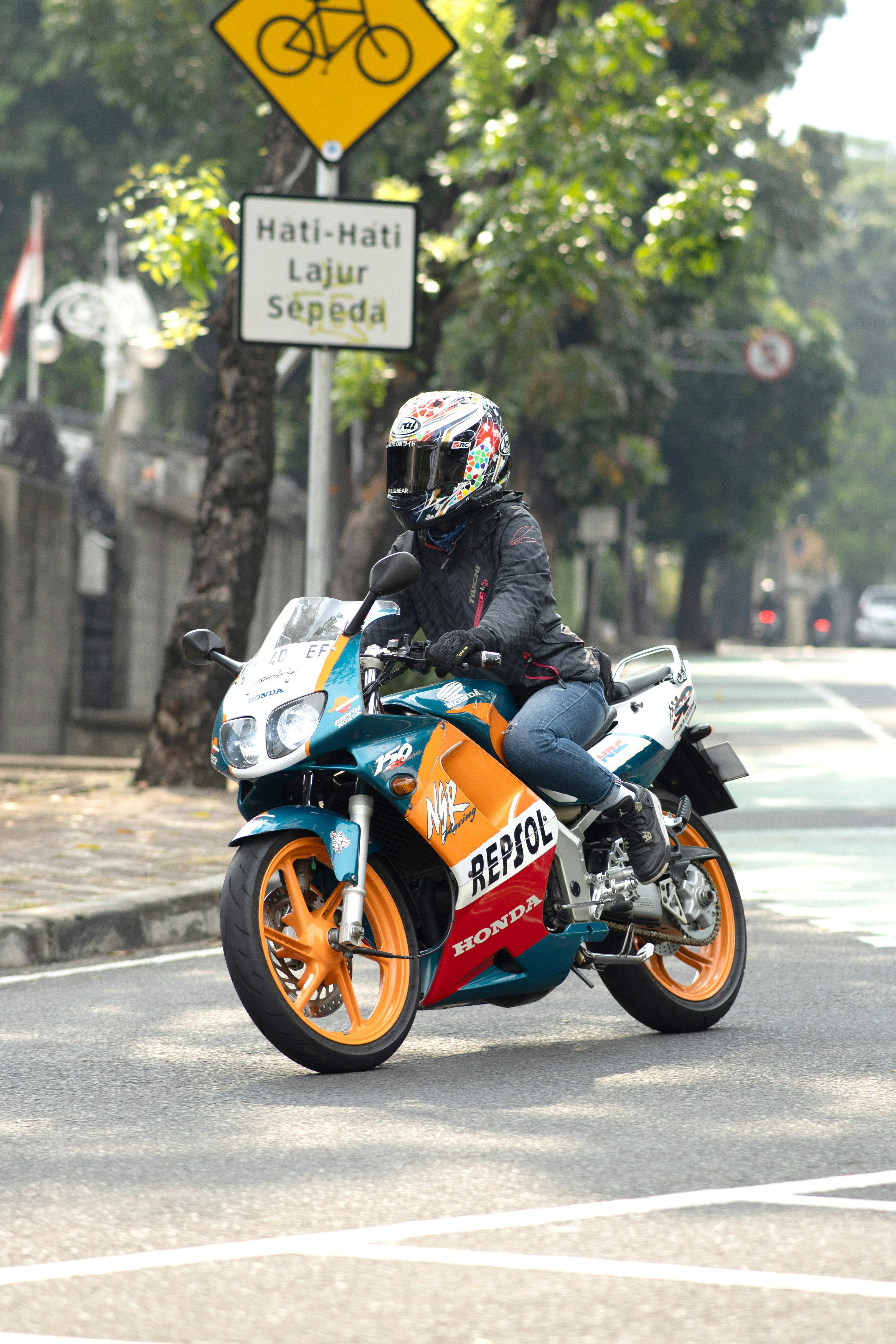 A person riding a motorcycle on a city street