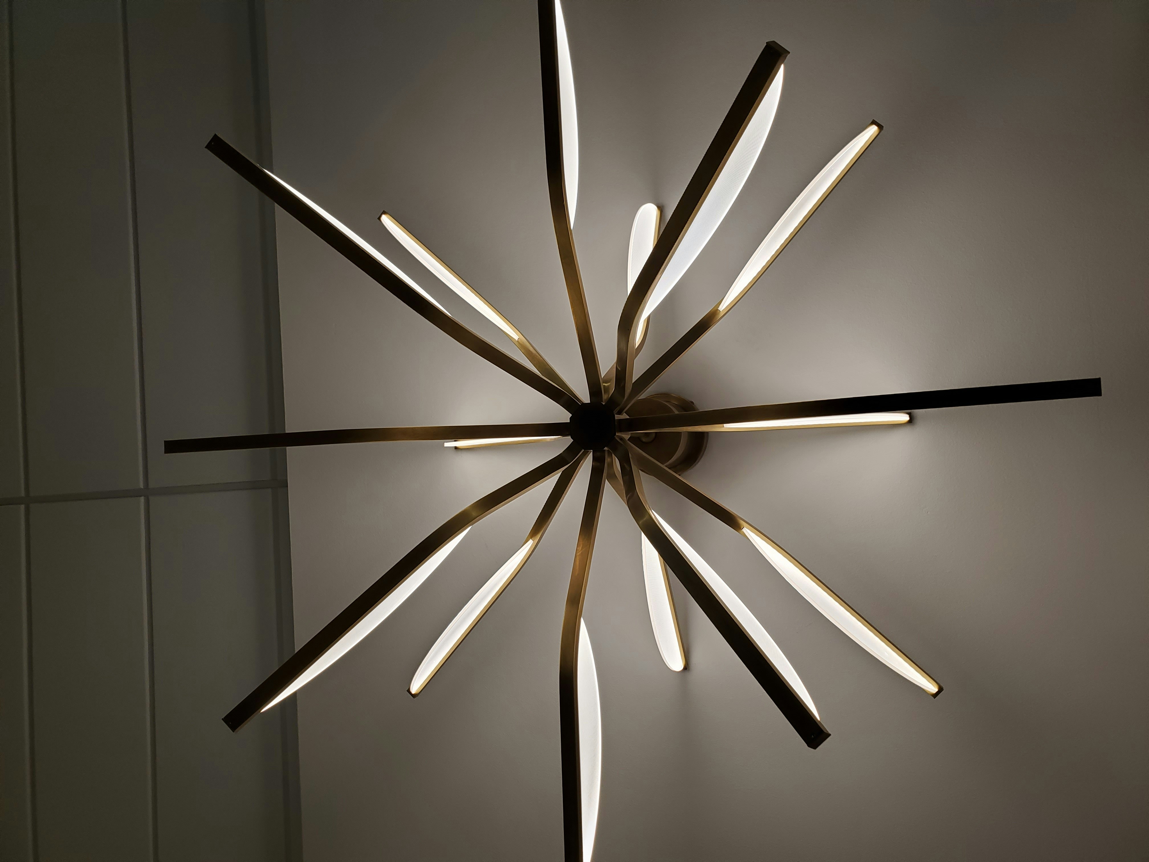 A star shaped light fixture hanging from a wall