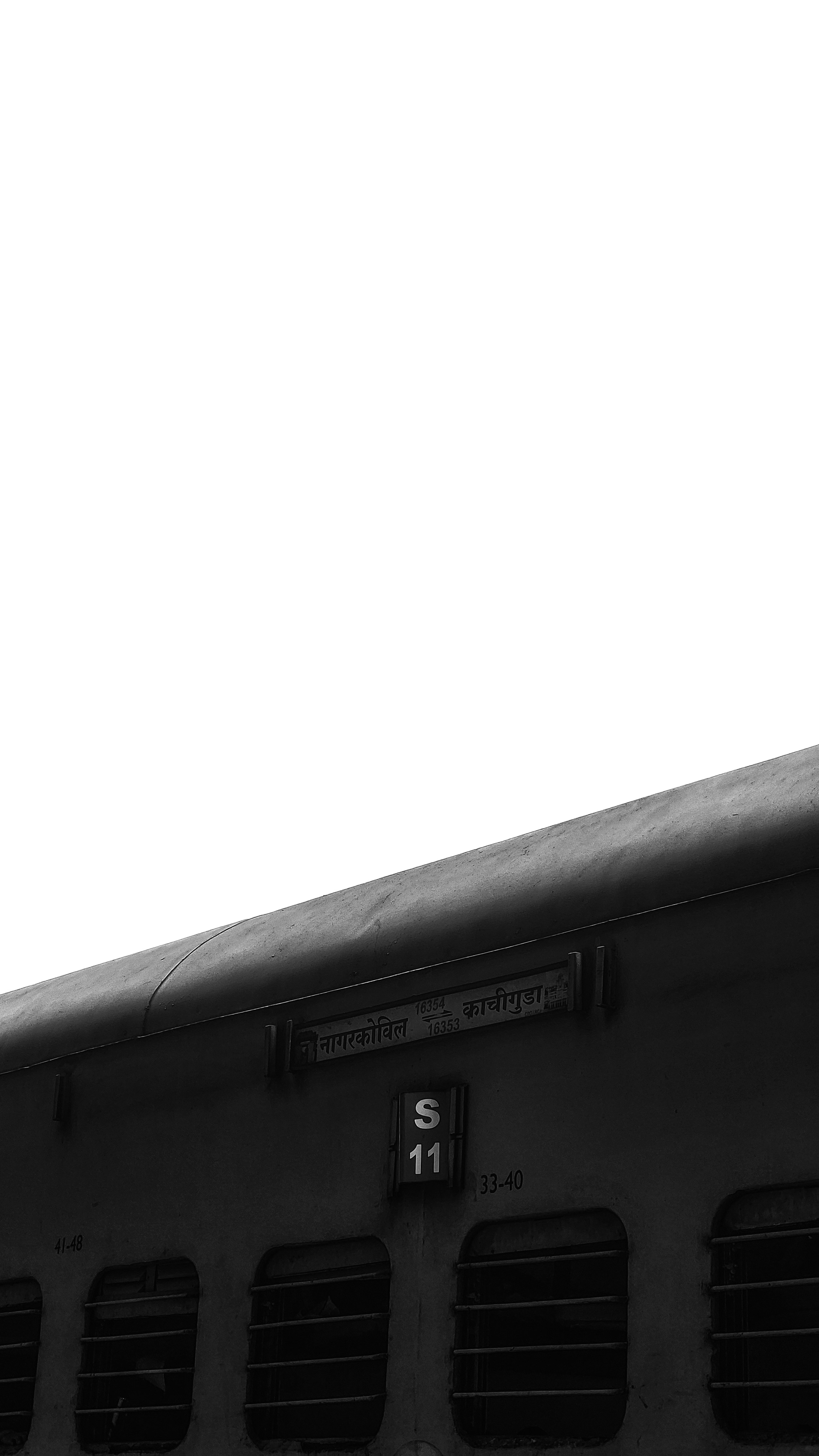 A black and white photo of a train