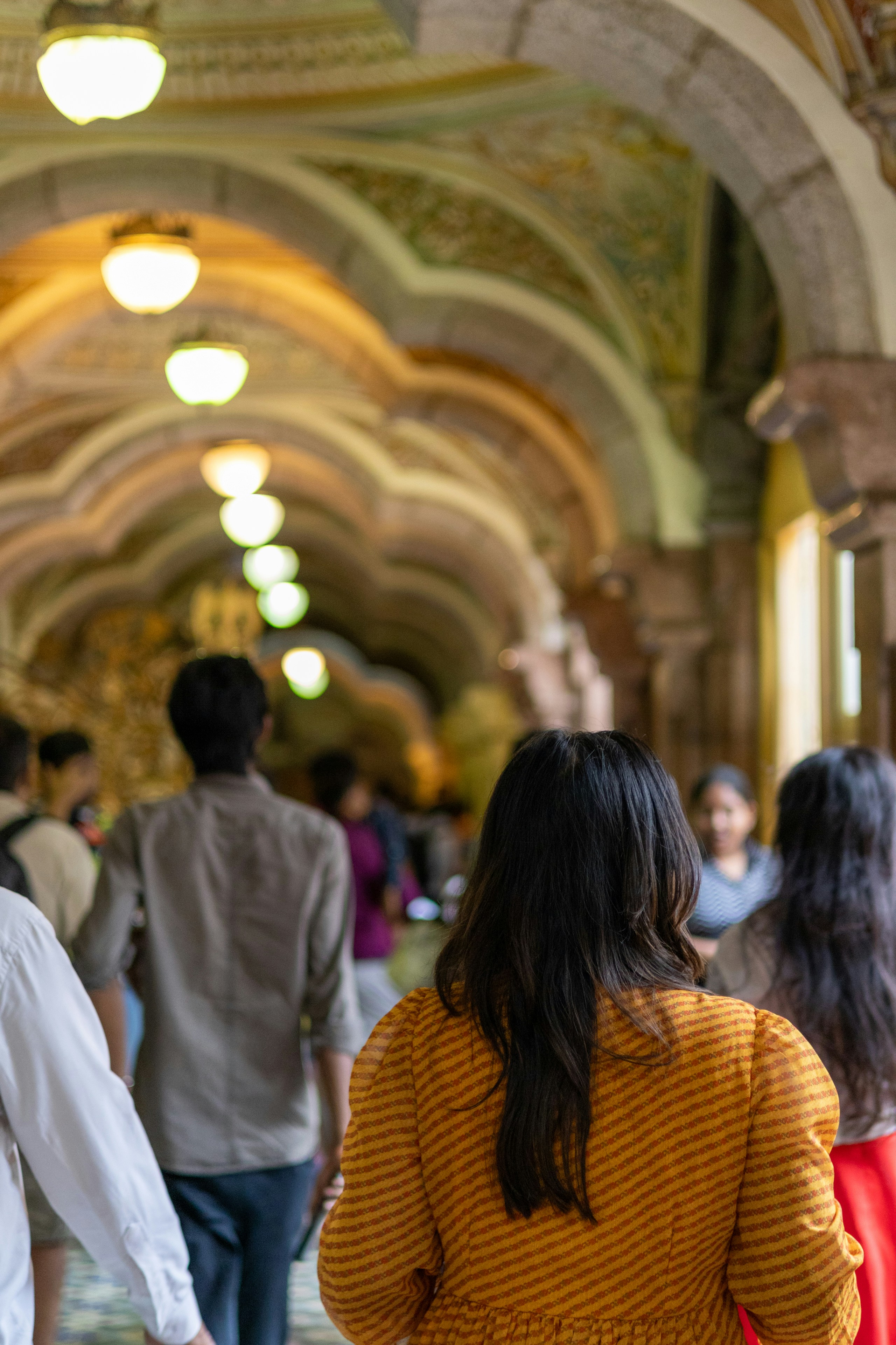 Students in a college hallway, India