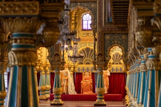 A church filled with gold and blue pillars