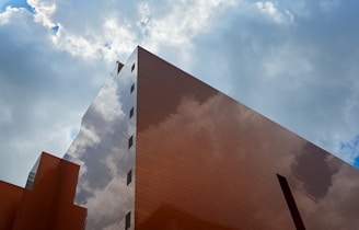 A tall building with a sky in the background