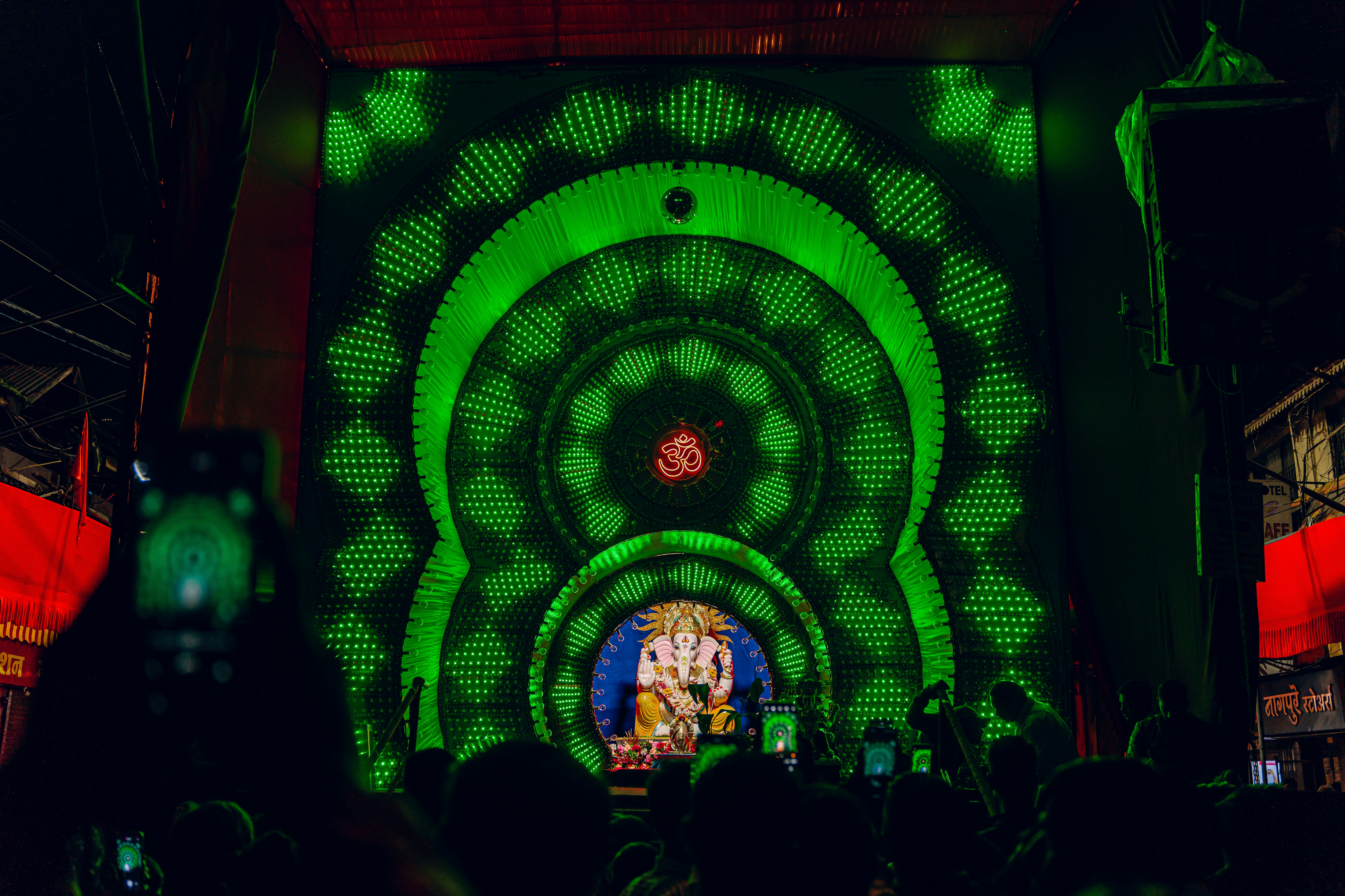 A crowd of people standing around a stage