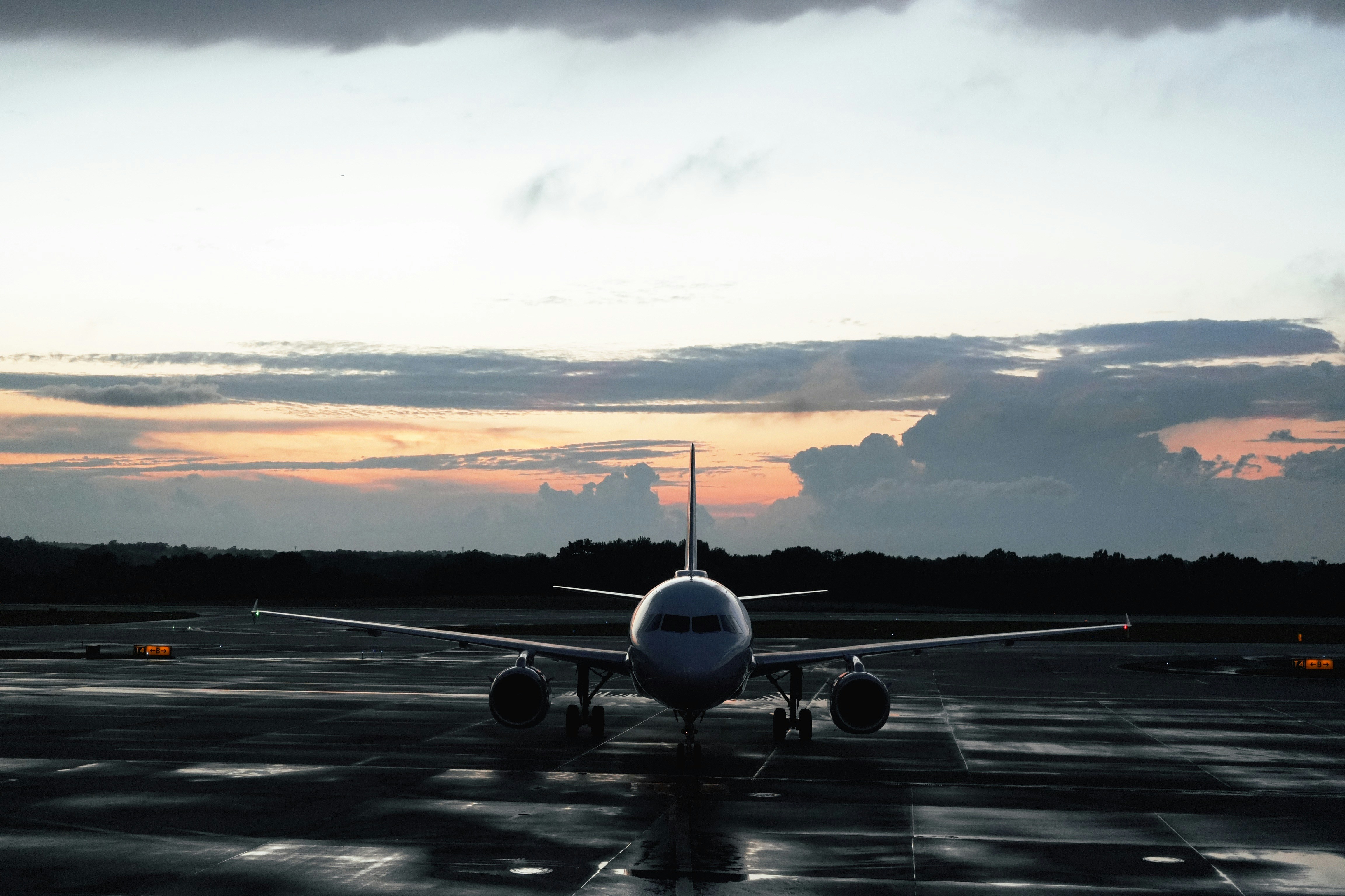 A large jetliner sitting on top of an airport tarmac