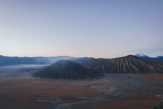 An aerial view of a mountain range in the distance