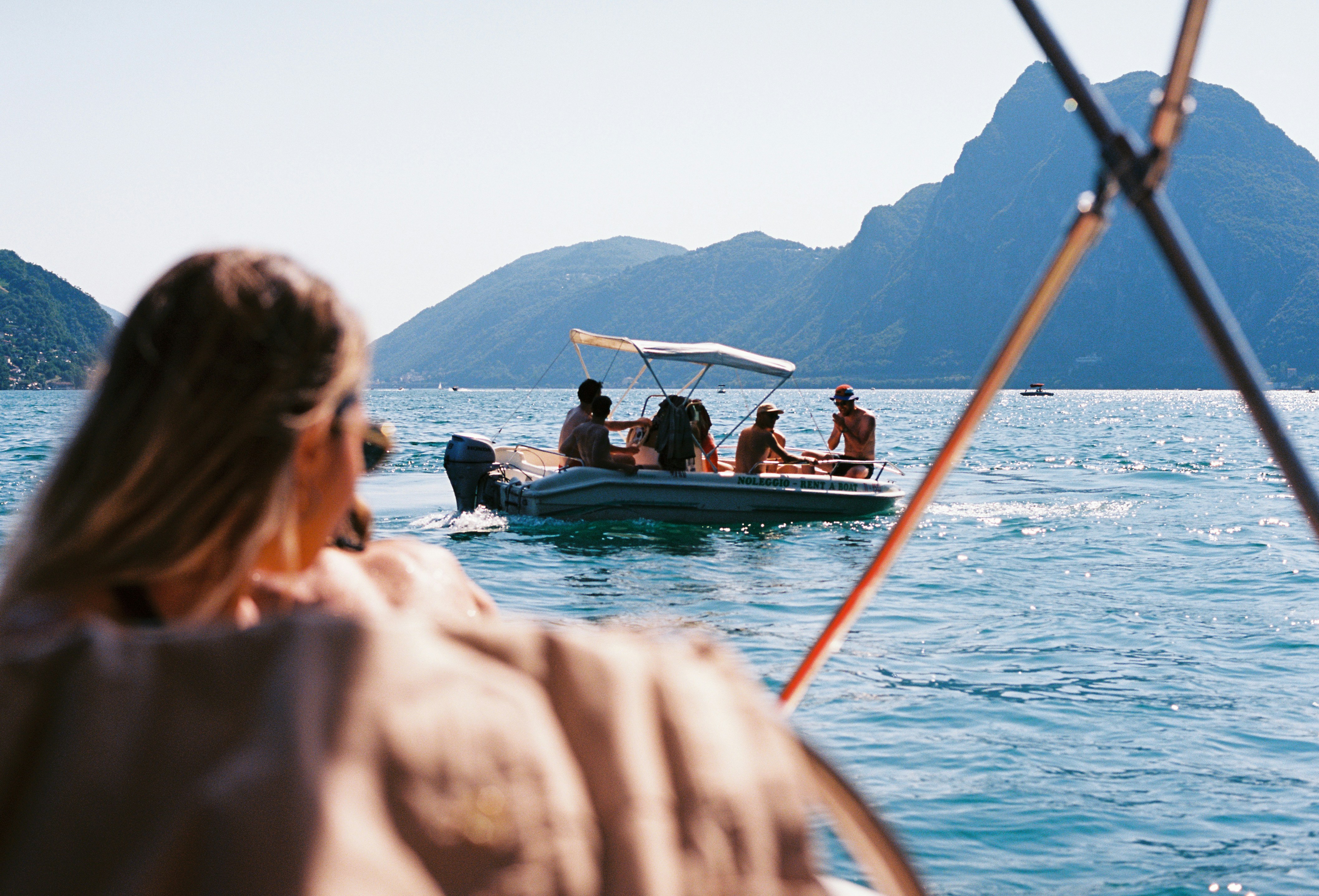A group of people on a boat in the water photo – Free Wallpaper Image ...