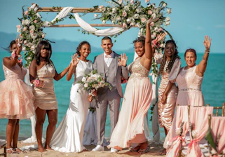 A group of people standing on top of a beach