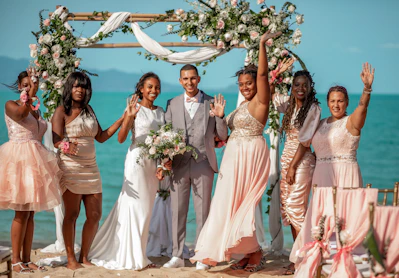 A group of people standing on top of a beach