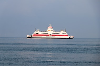 A large boat floating on top of a large body of water