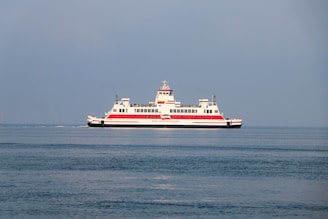 A large boat floating on top of a large body of water