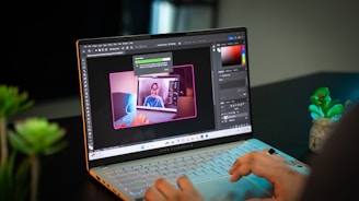 A person sitting at a table with a laptop