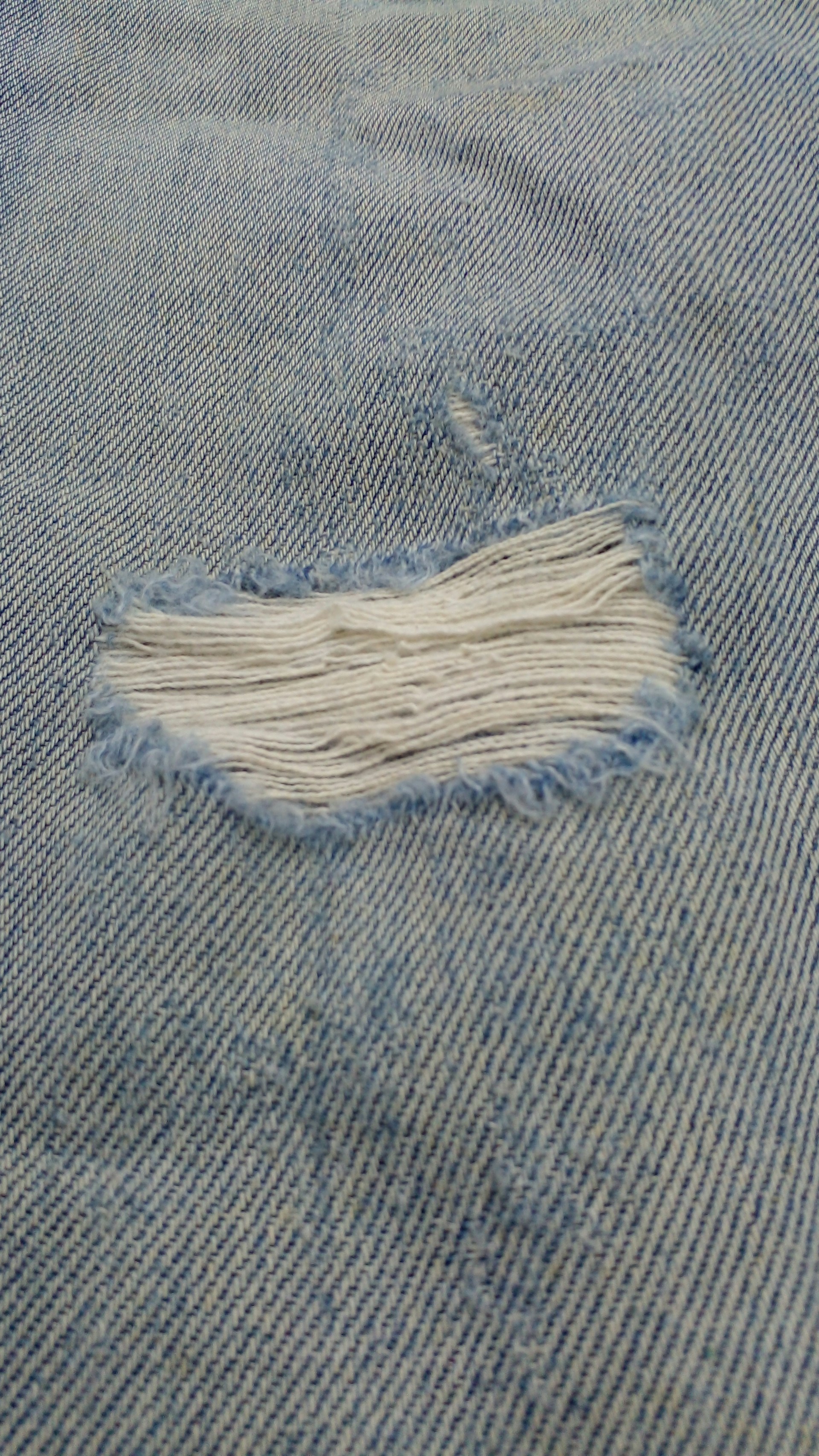 A piece of cloth that has been torn off