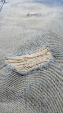 A piece of cloth that has been ripped off
