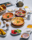 A table topped with lots of different types of food