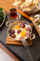 A wooden table topped with a bowl of food