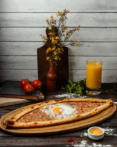 A large pizza sitting on top of a wooden table