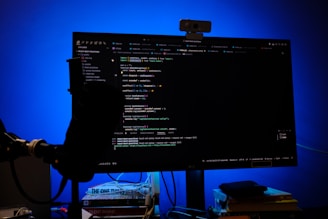 A computer monitor sitting on top of a desk