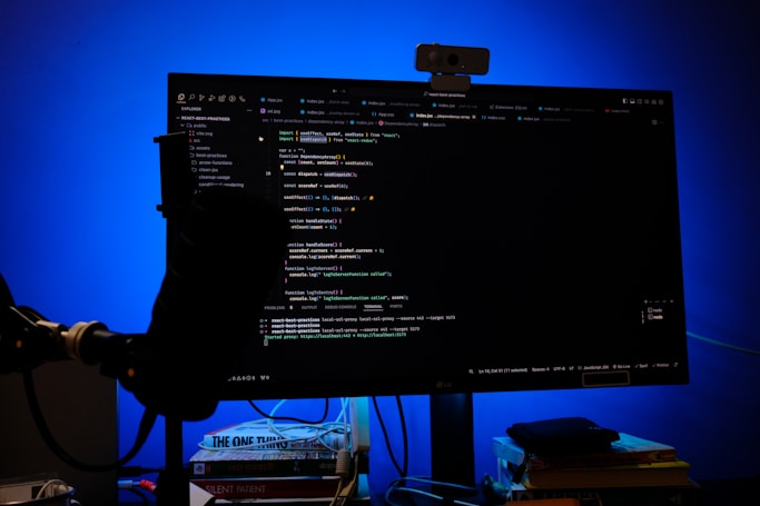 A computer monitor sitting on top of a desk