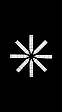 A black and white photo of a cross on a black background