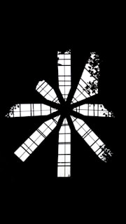 A black and white photo of a cross