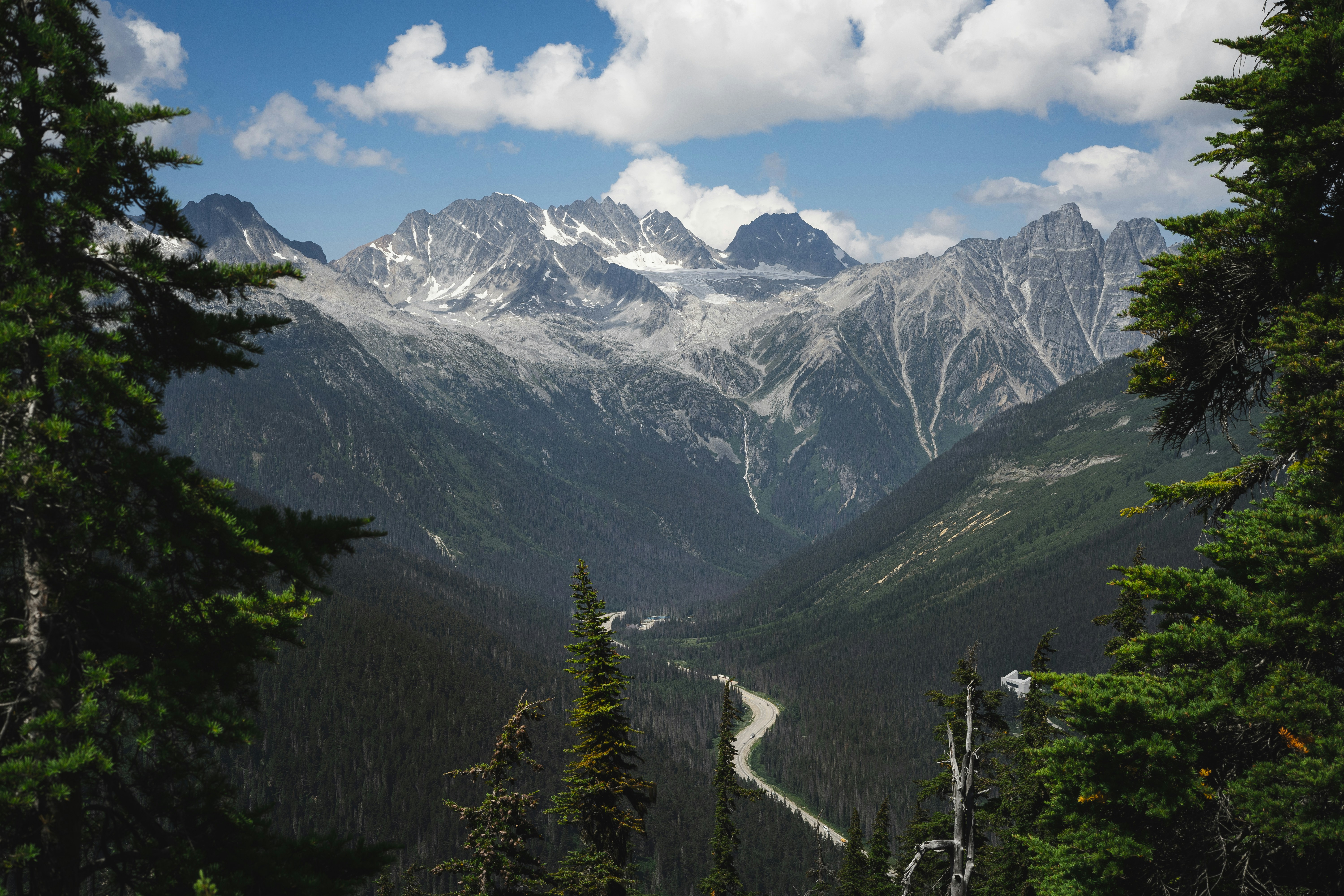 A scenic view of mountains and a road