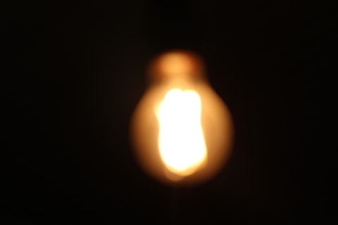 A close up of a light bulb in the dark