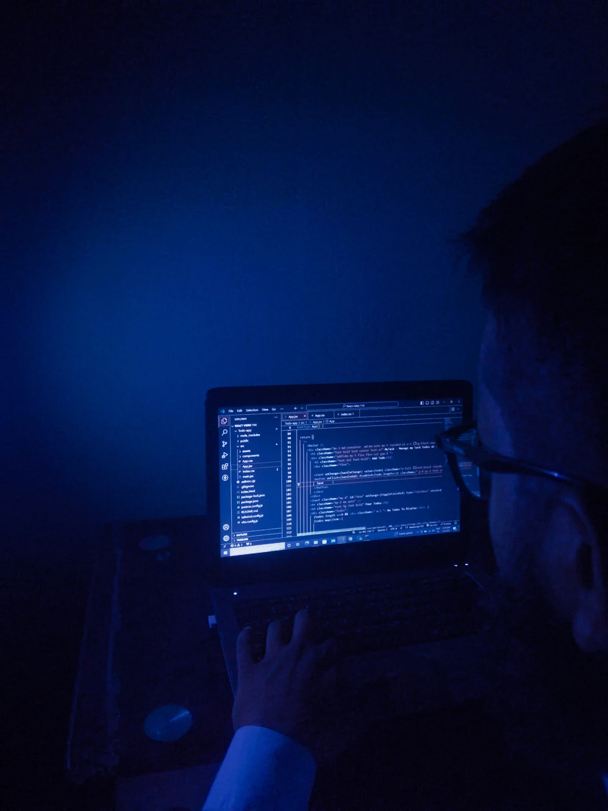 AI web development workspace with developer using artificial intelligence tools for coding and automation