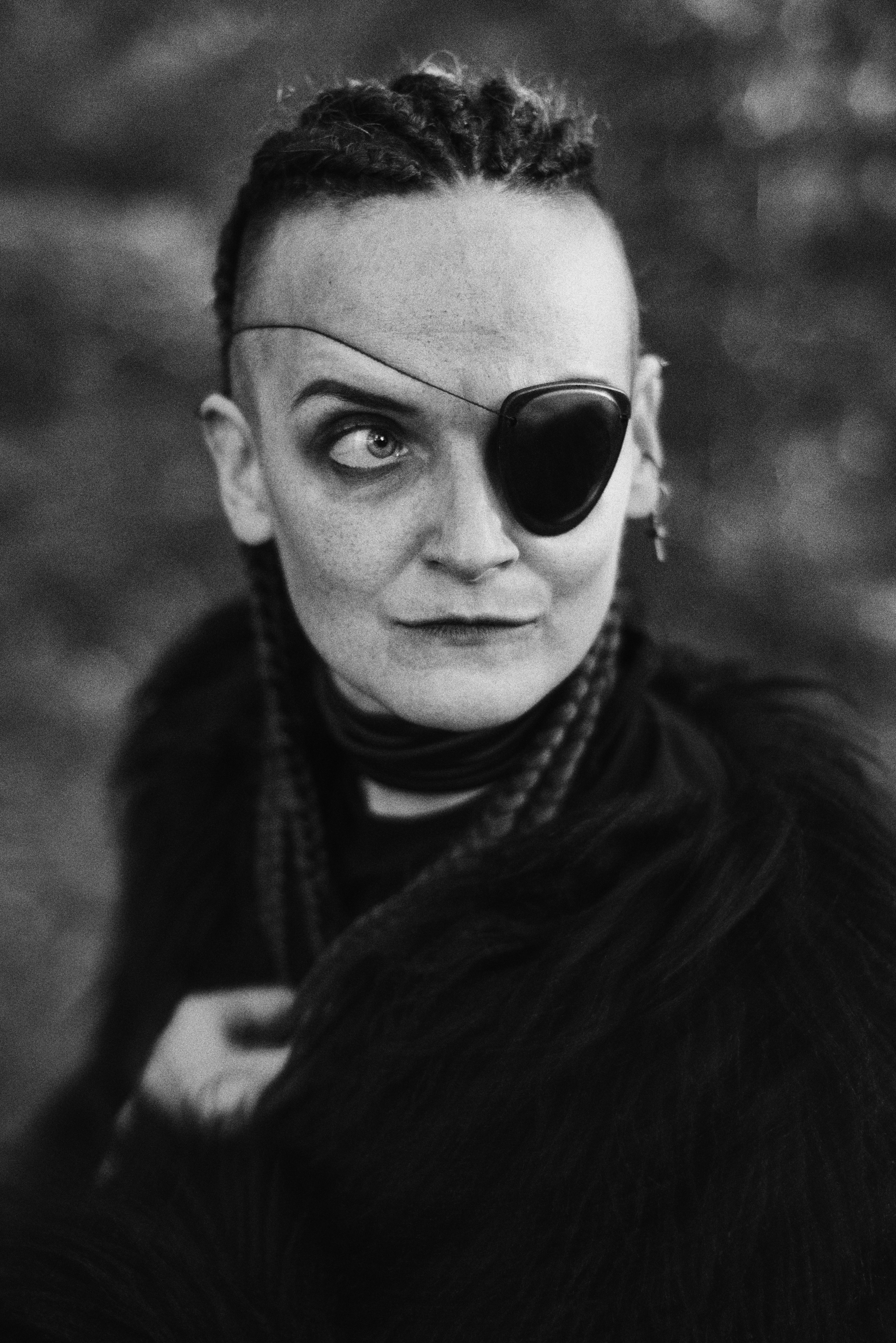 A woman with a fake eye patch on her face