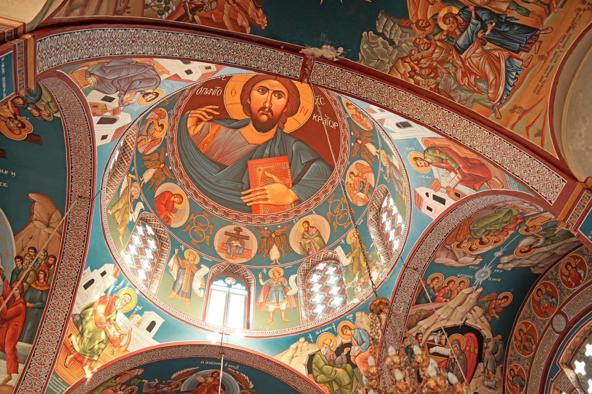 A painting of jesus on the ceiling of a church