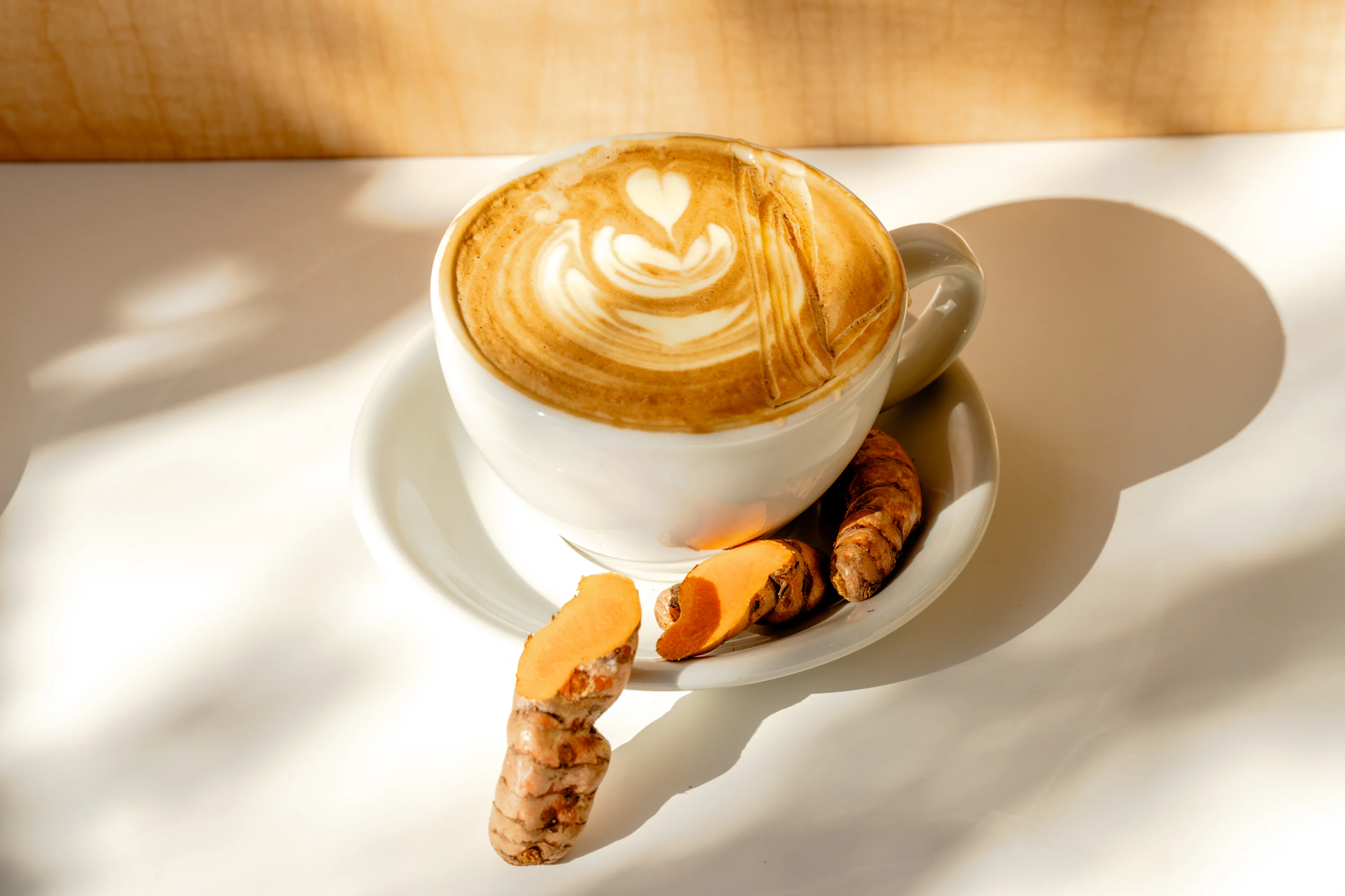 A cappuccino on a saucer on a table