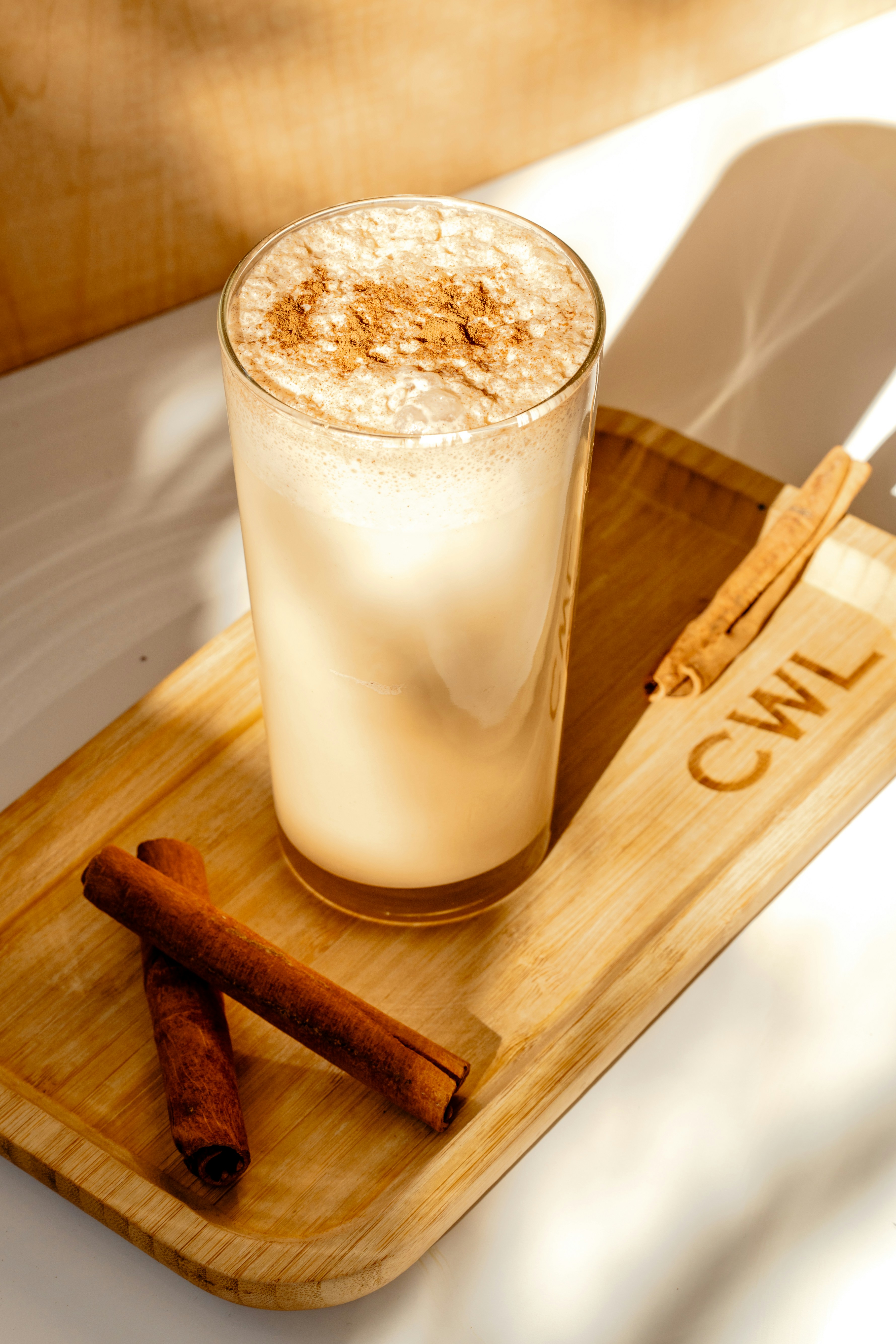 Cozy warm beverage with cinnamon stick and whipped cream