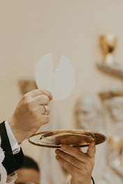 A close up of a person holding a plate