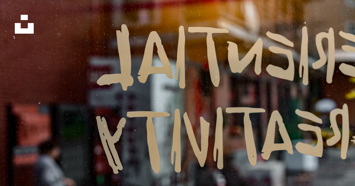 A window with a sign that says existent creativity photo – Free City ...