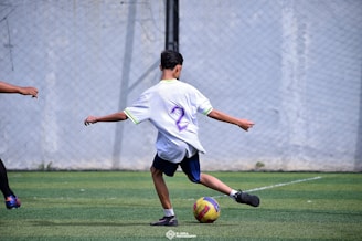 A group of young men playing a game of soccer