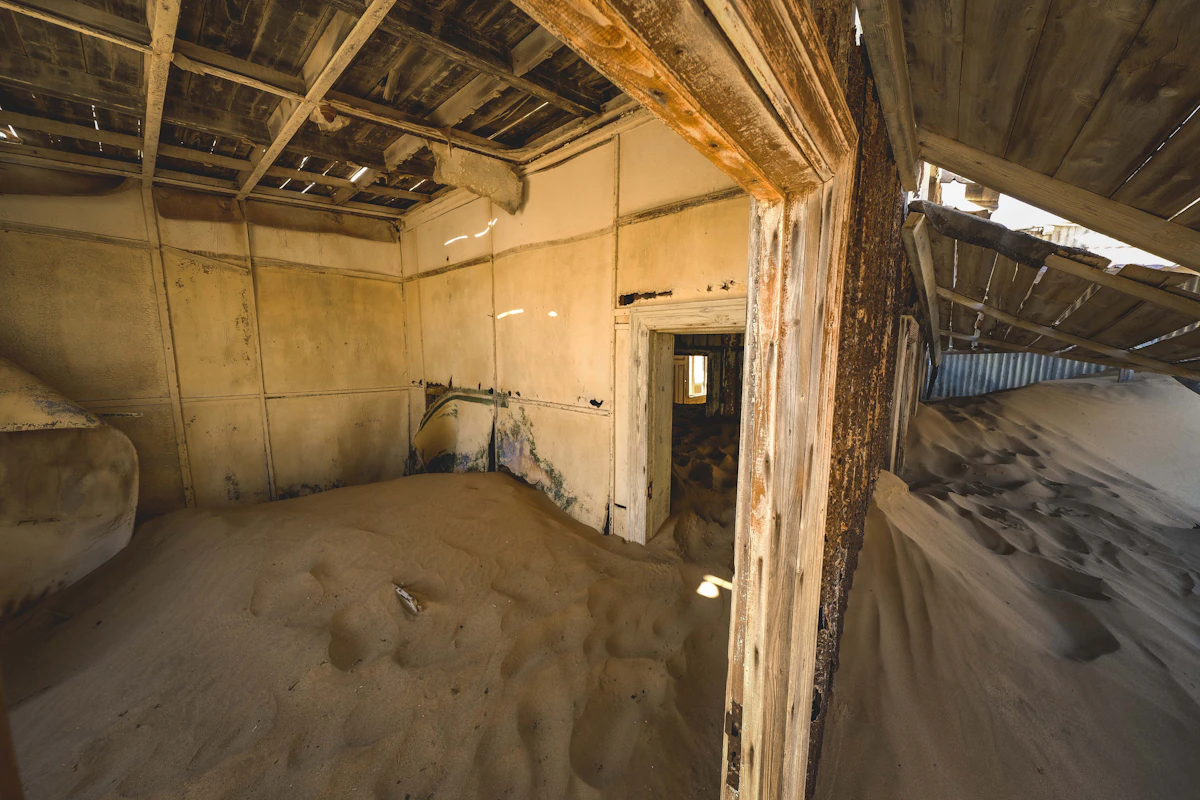 Kolmanskop ballroom with sand dunes covering the floor