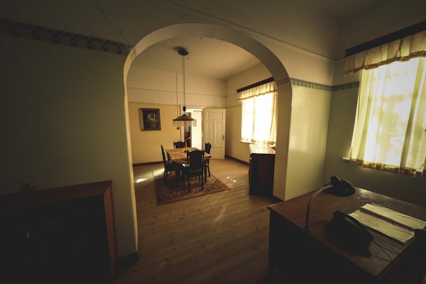 A room with a desk and a chair in it