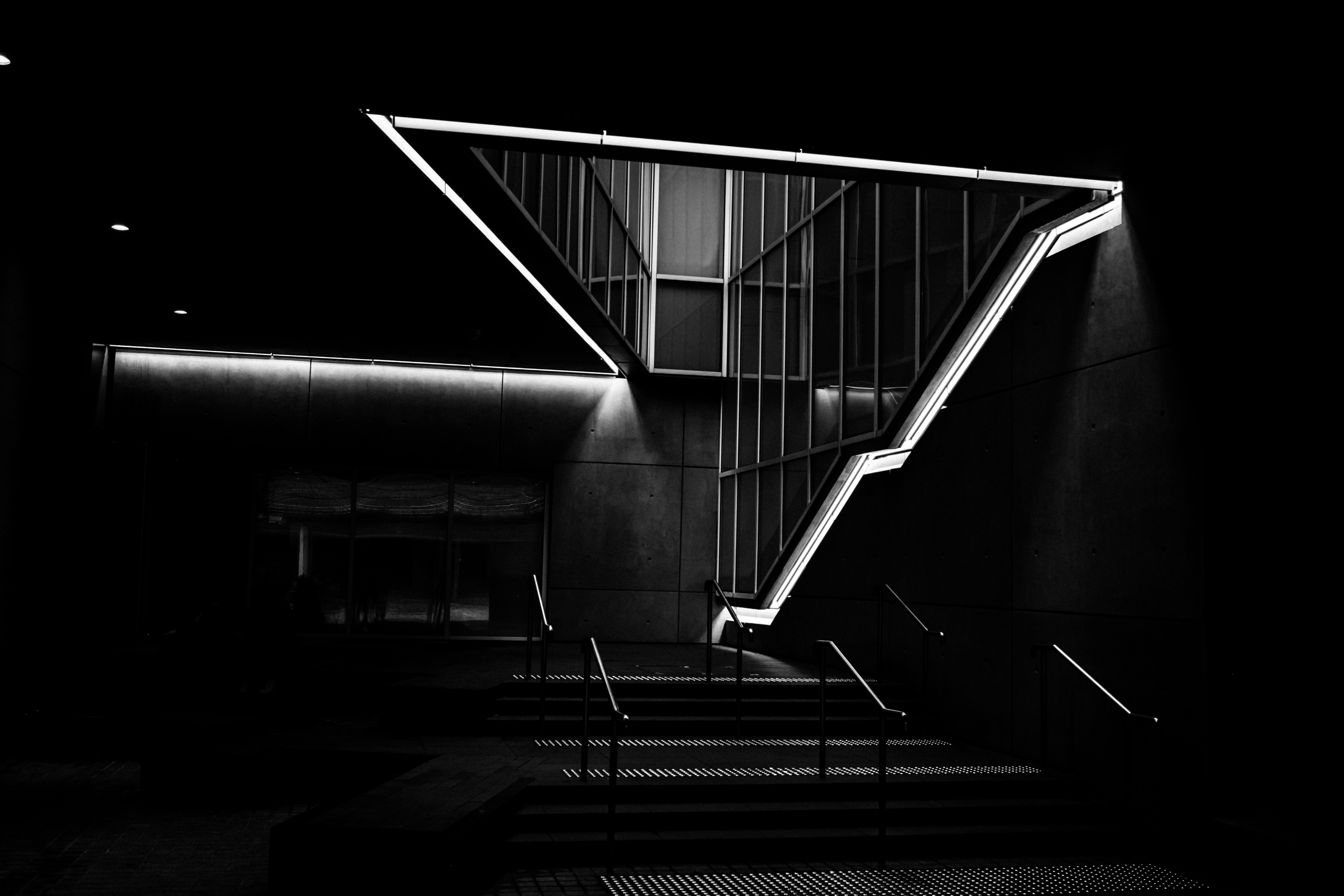 solitary figure in a dark corridor