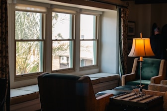 A living room filled with furniture and a lamp